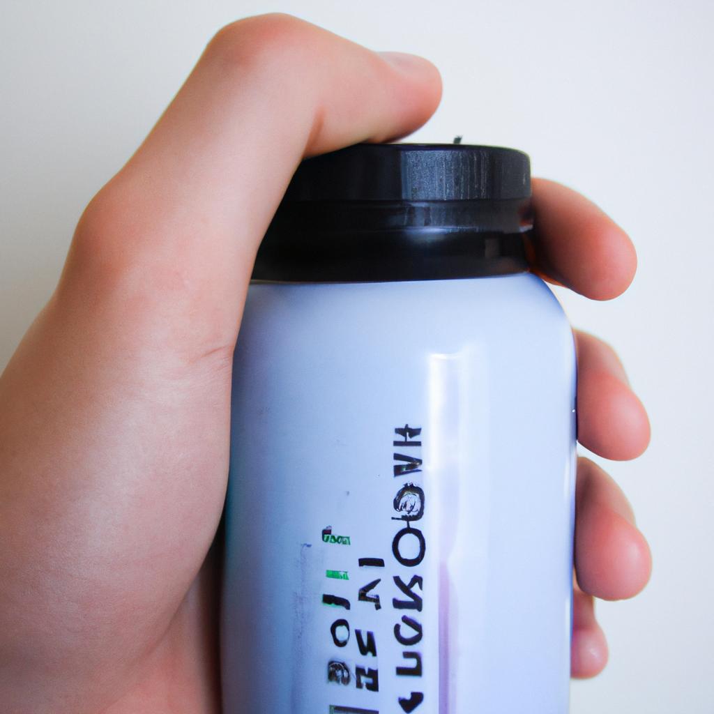 Person holding dietary supplements bottle