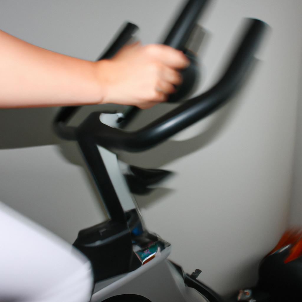 Person using stationary exercise bike